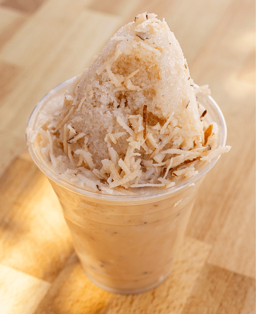 Coconut raspado in a clear cup