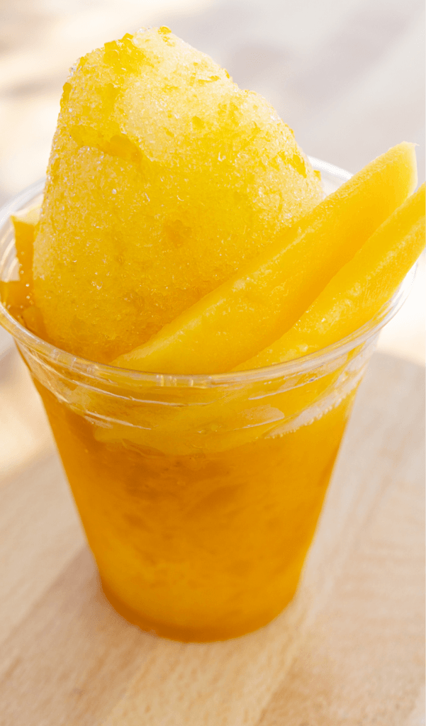 Mango raspado topped with fresh mango